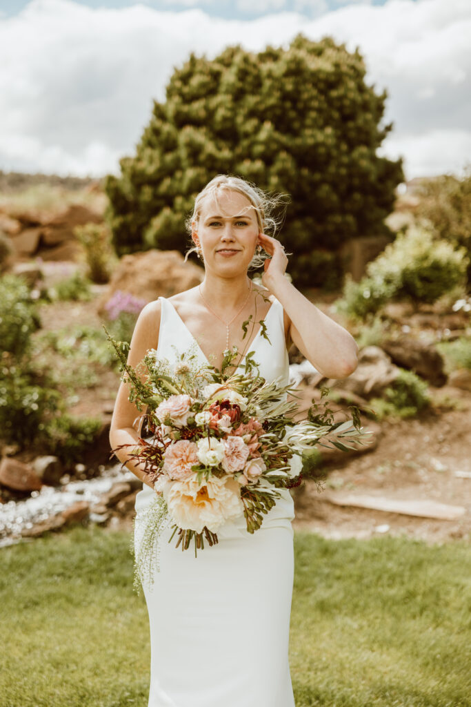 destination elopement bride on her elopement day holding bouquet of flowers in wedding dress in bend Oregon 
