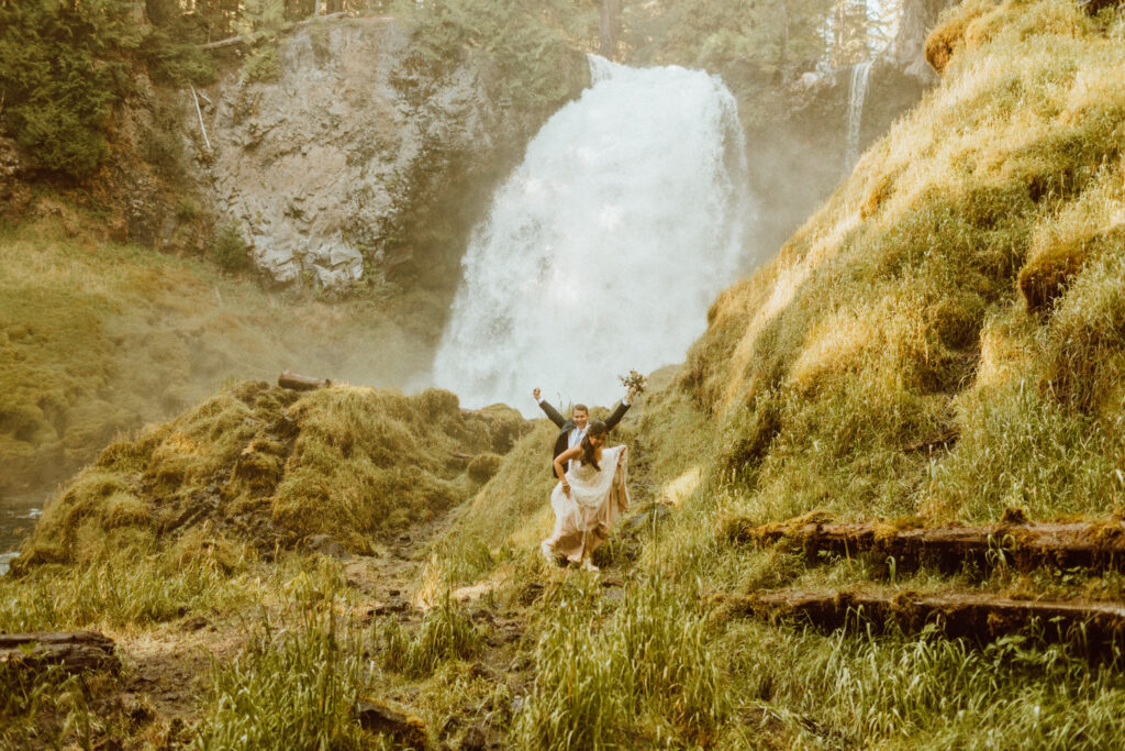 bride and groom elopement at an Oregon waterfall mid august 