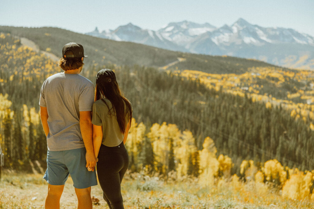 couples pose in Telluride colorado on top of mountain