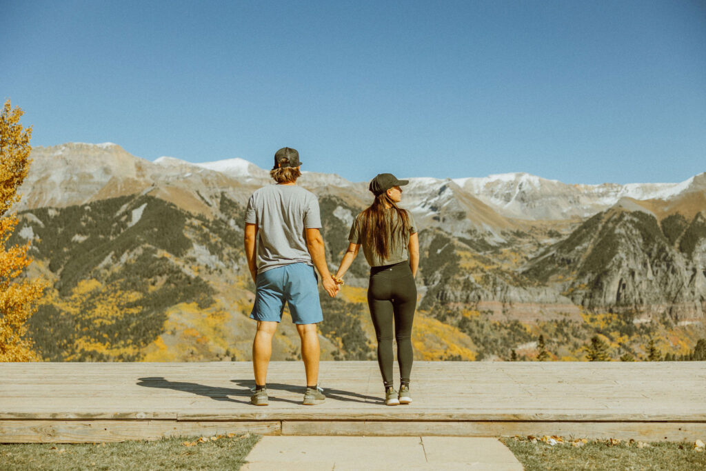 couple poses in Telluride colorado on top of mountain elopement destinations