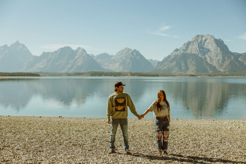 couple poses at grand Teton national park in Wyoming for destination wedding and elopement photographer