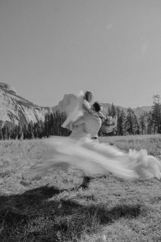 couple dancing in half dome meadown at yosemite national park for their deestination elopement 