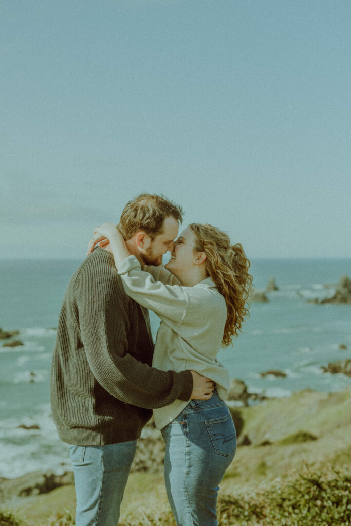 couple posing for their destination engagement photos at Samuel H Boardman state park on the oregon coast with bend oregon wedding photographer esther rohr 
