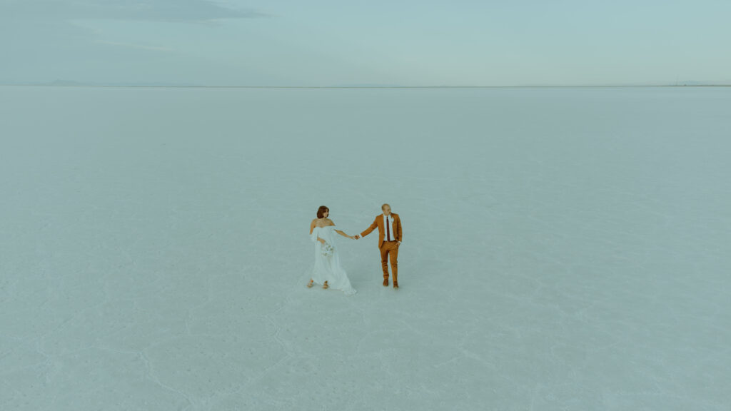 drone photo of bride and groom on the utah salt flats 