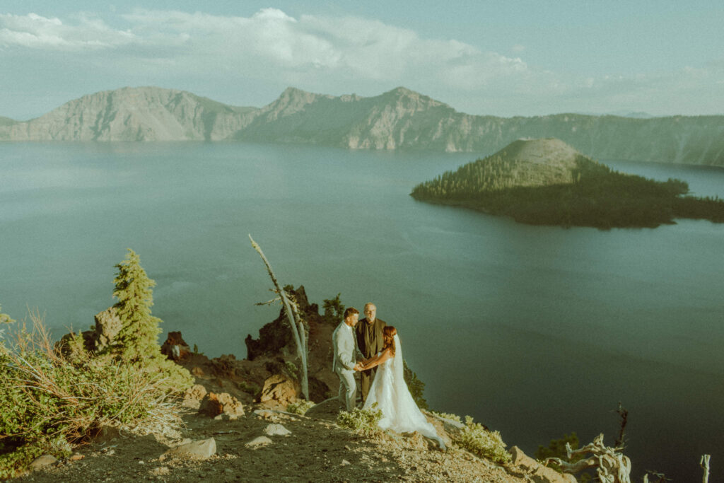 sunset crater lake oregon elopement with bride and groom 