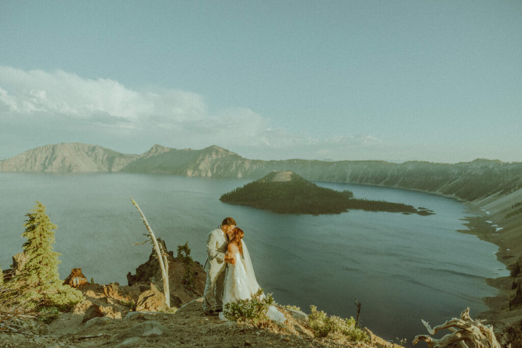 bride and groom kiss at elopement at crater lake national park in oregon 