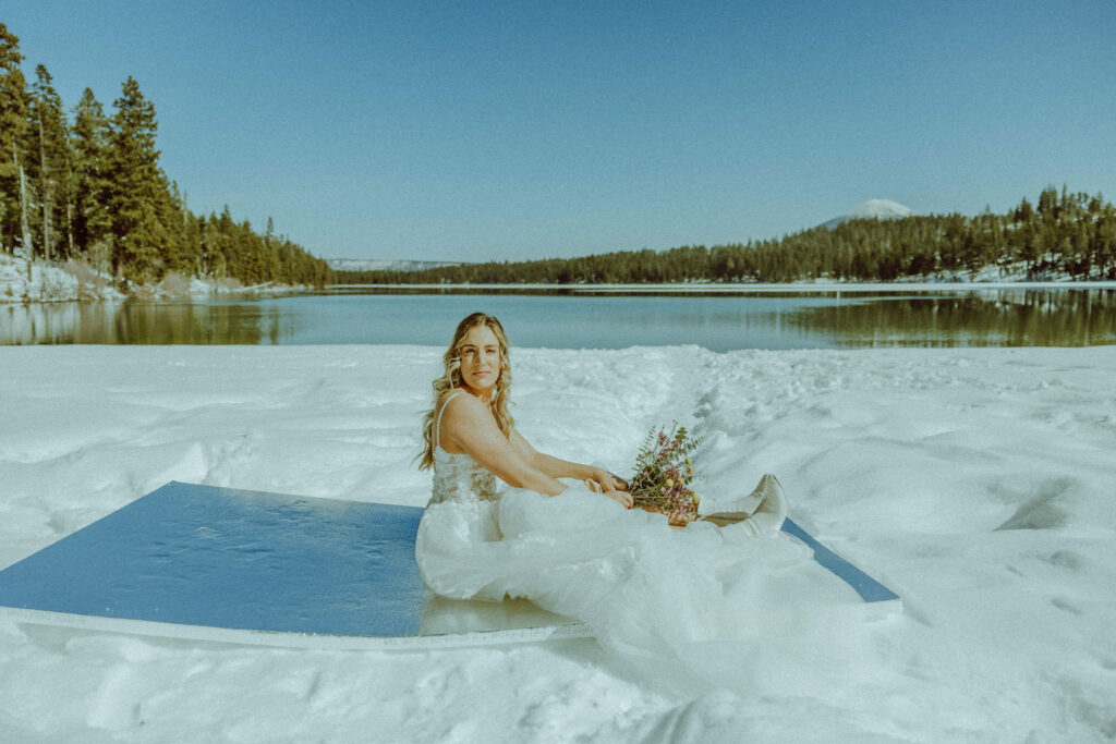 bride in wedding dress at winter elopement in bend oregon at suttle lake 