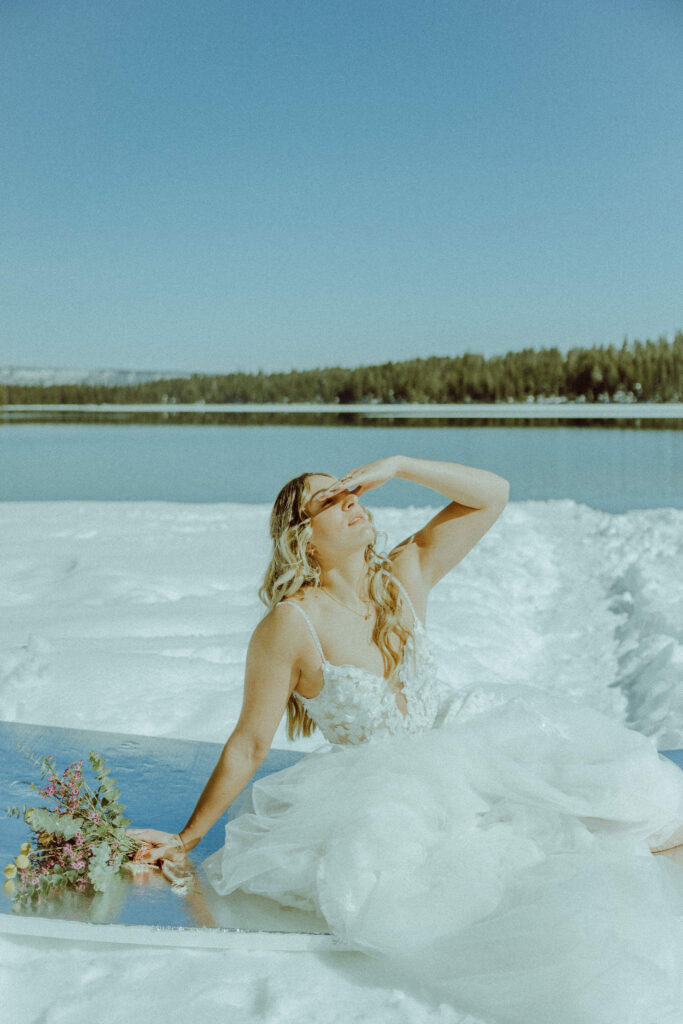 bride in wedding dress at winter elopement in bend oregon at suttle lake 