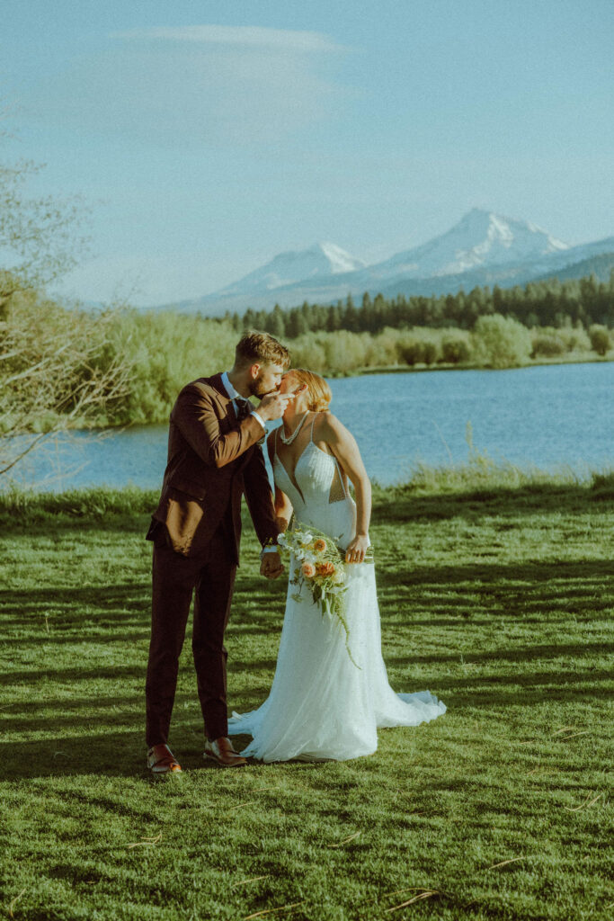 bride and groom posing for photo at wedding venue black butte ranch 