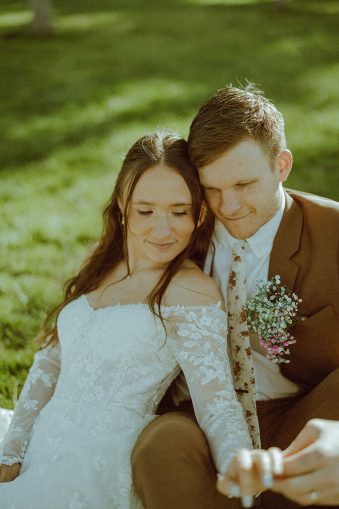 bride and groom posing at hollinshead barn wedding venue in hollinshead park bend oregon 