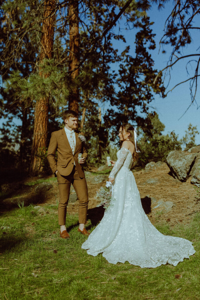 bride and groom posing at hollinshead park bend oregon 