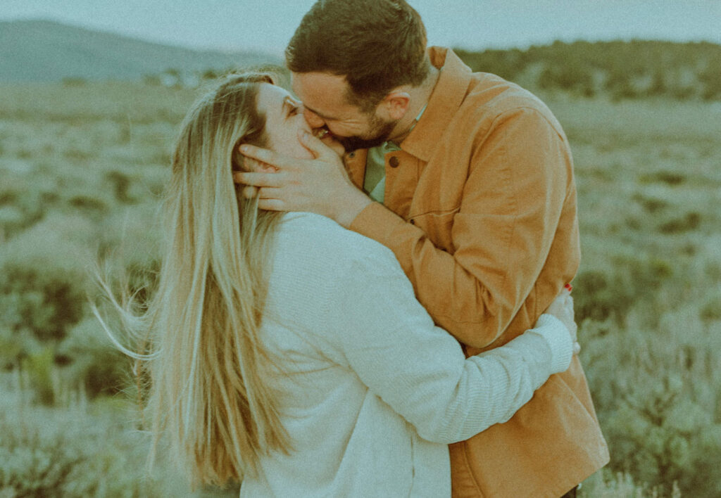 bride and groom posing in a field of sagebrush for oregon badlands engagement session