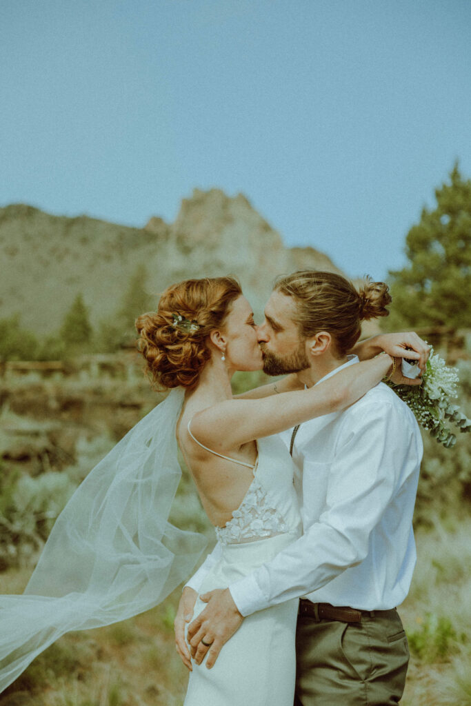 bride and groom kissing