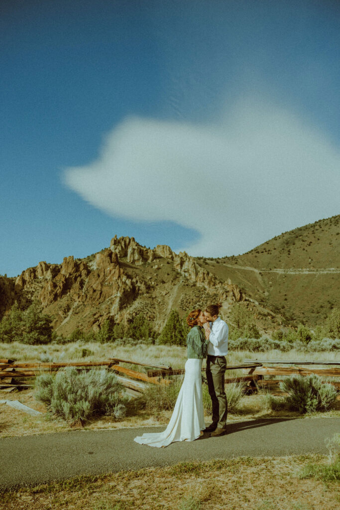 bride and groom kissing at elopement at smith rock state park in oregon