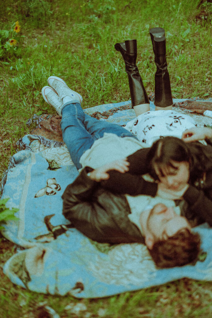 couple on a blanket at their oregon engagement session in the gorge