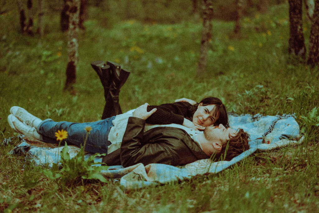 couple on a blanket at their oregon engagement session in the gorge