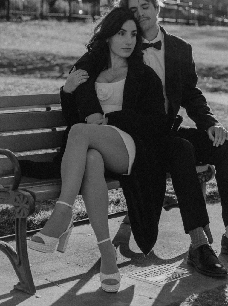 couple posing on a park bench in bend oregon for their editorial engagement photos