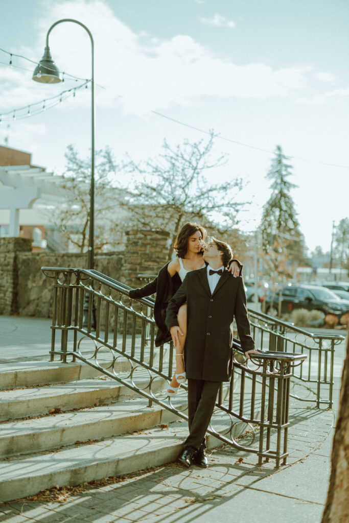 couple posing for their editorial engagement photos in downtown bend oregon