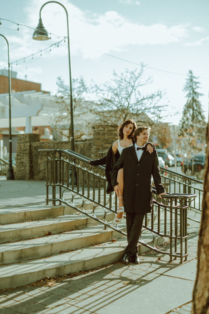 couple posing for their editorial engagement photos in downtown bend oregon