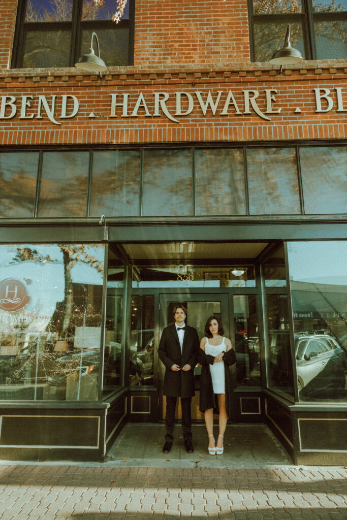 bride and groom posing for editorial engagement photo in bend oregon