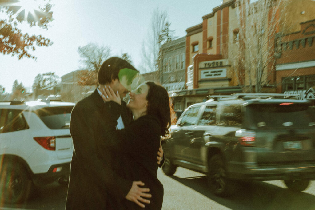 couple posing for their editorial engagement photos in downtown bend oregon