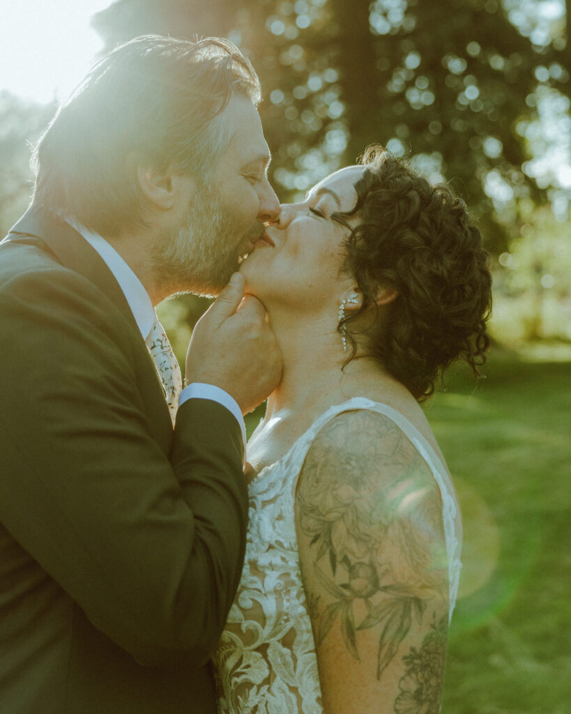 bride and groom kiss at lake creek lodge