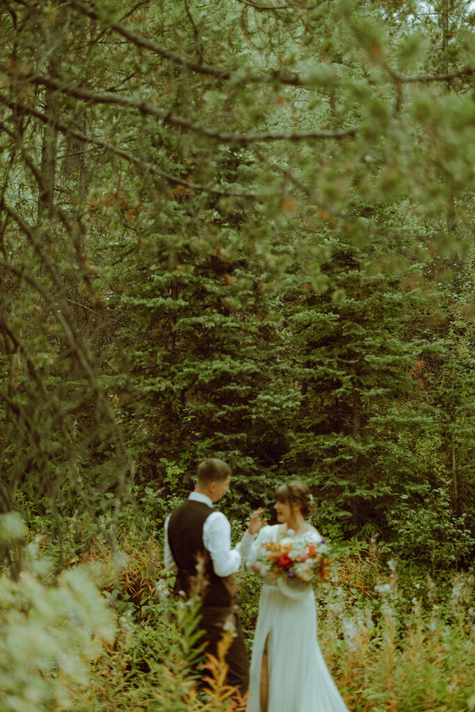 bride and groom exchange wedding vows in the forest bend oregon