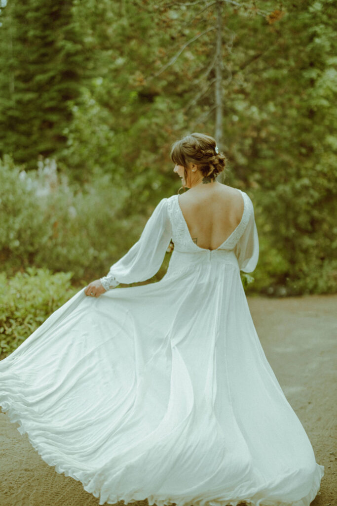 bride posing with wedding dress flowing