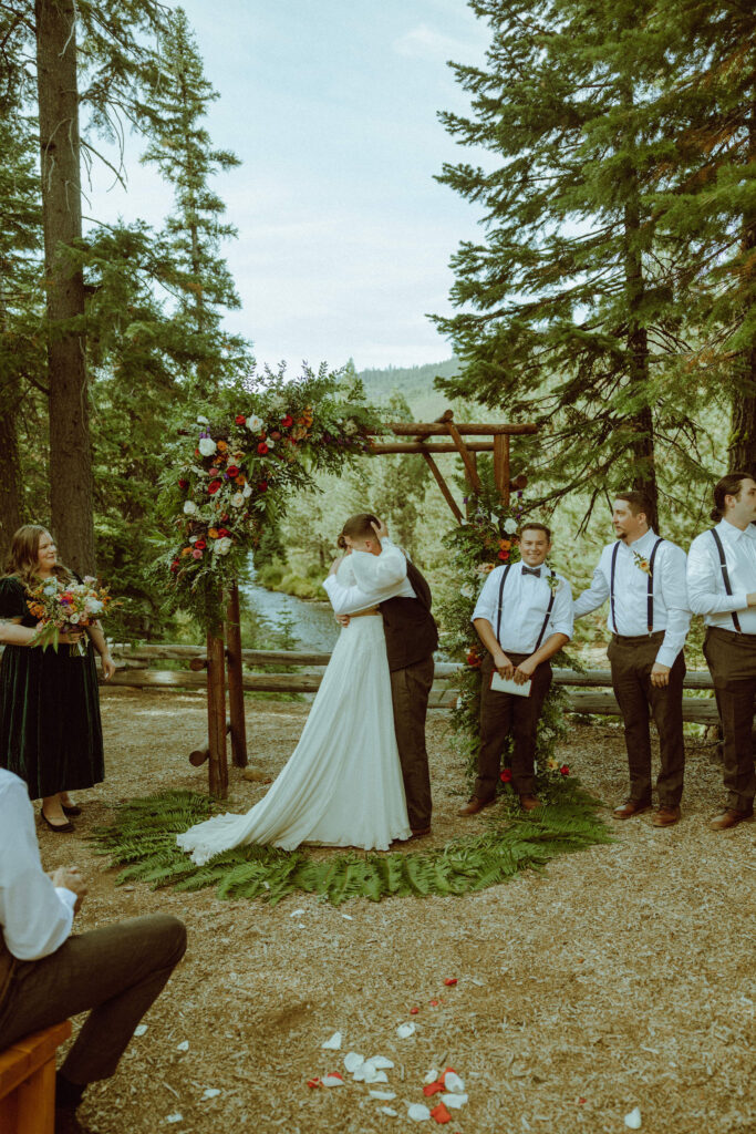 bride and groom kissing at skyliner lodge wedding venue 