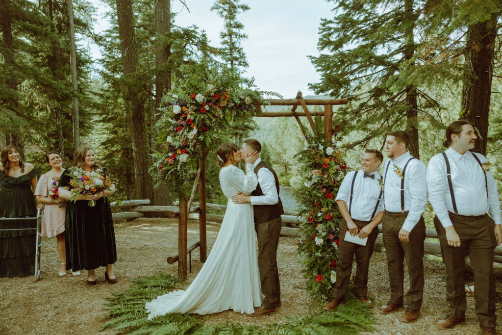 bride and groom kissing at skyliner lodge wedding venue 