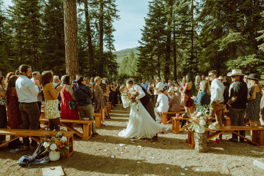 bride and groom kissing at skyliner lodge wedding venue 