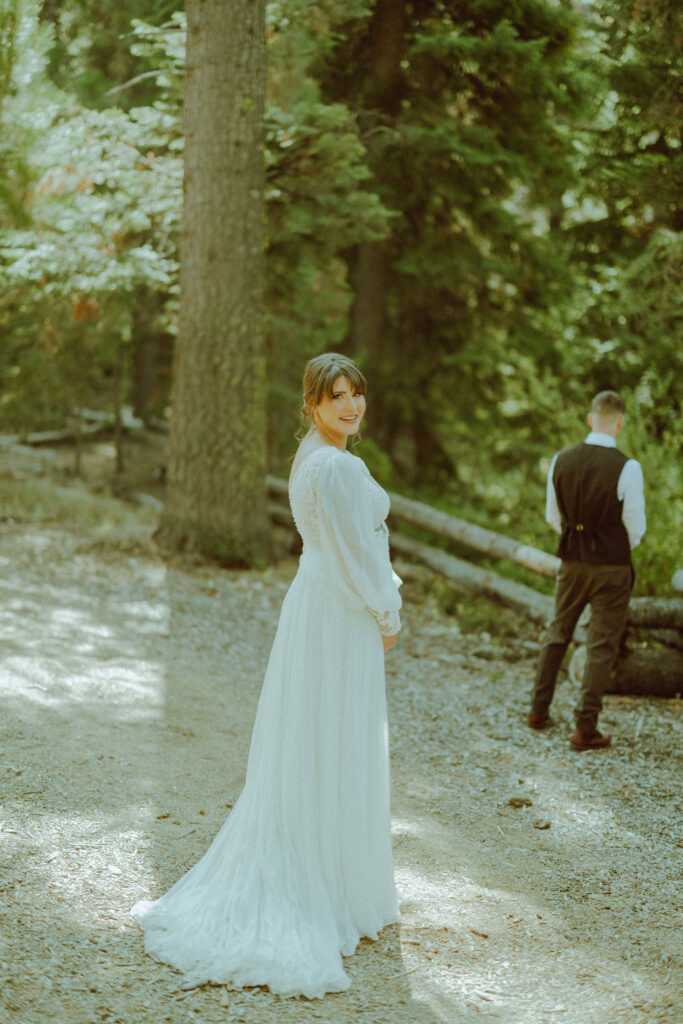 bride and groom first look at skyliner lodge wedding in the forest bend oregon