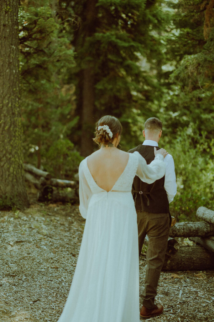 bride and groom first look at skyliner lodge wedding in the forest bend oregon