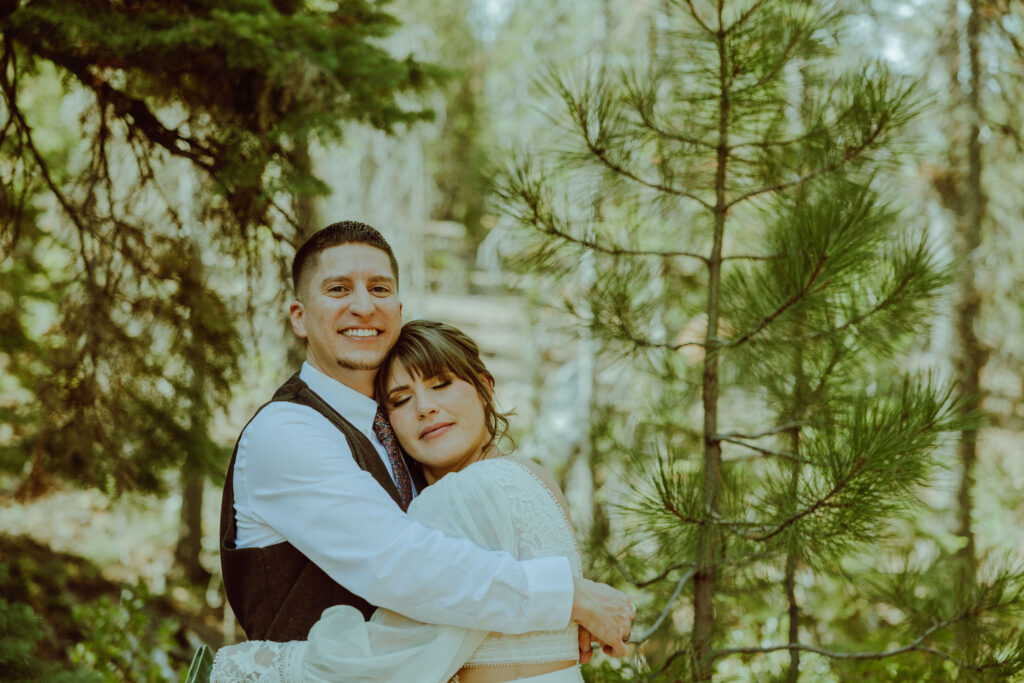 bride and groom first look at skyliner lodge wedding in the forest bend oregon