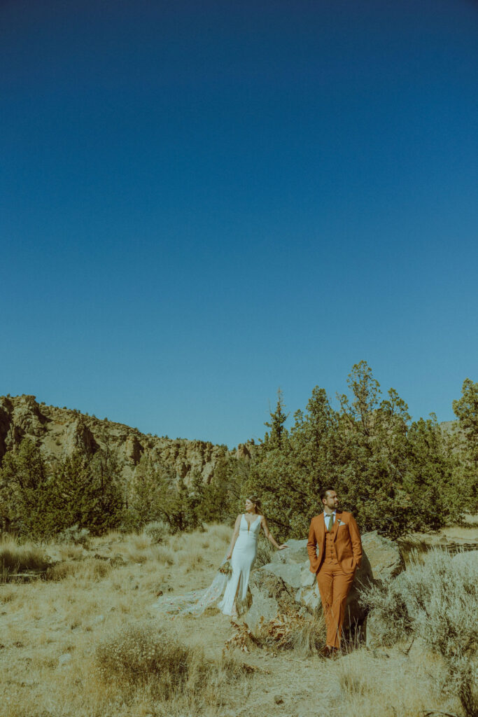 bride and groom posing for wedding photo at smith rock state park 