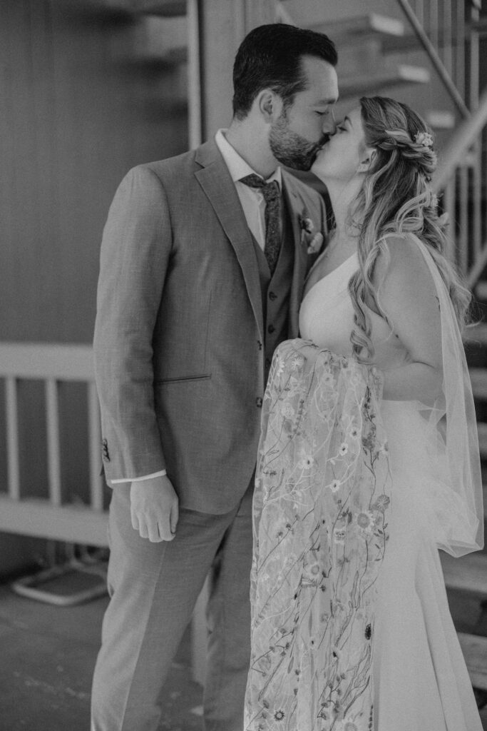 bride and groom kissing at campfire hotel in bend oregon 