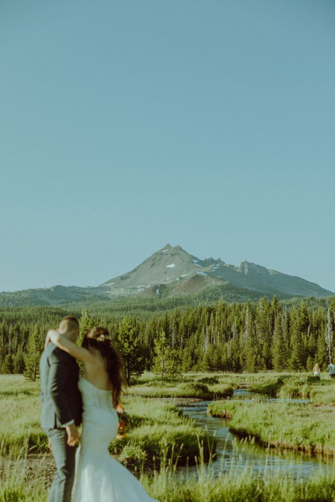 broken top mountain in the background of bride and groom elopement 