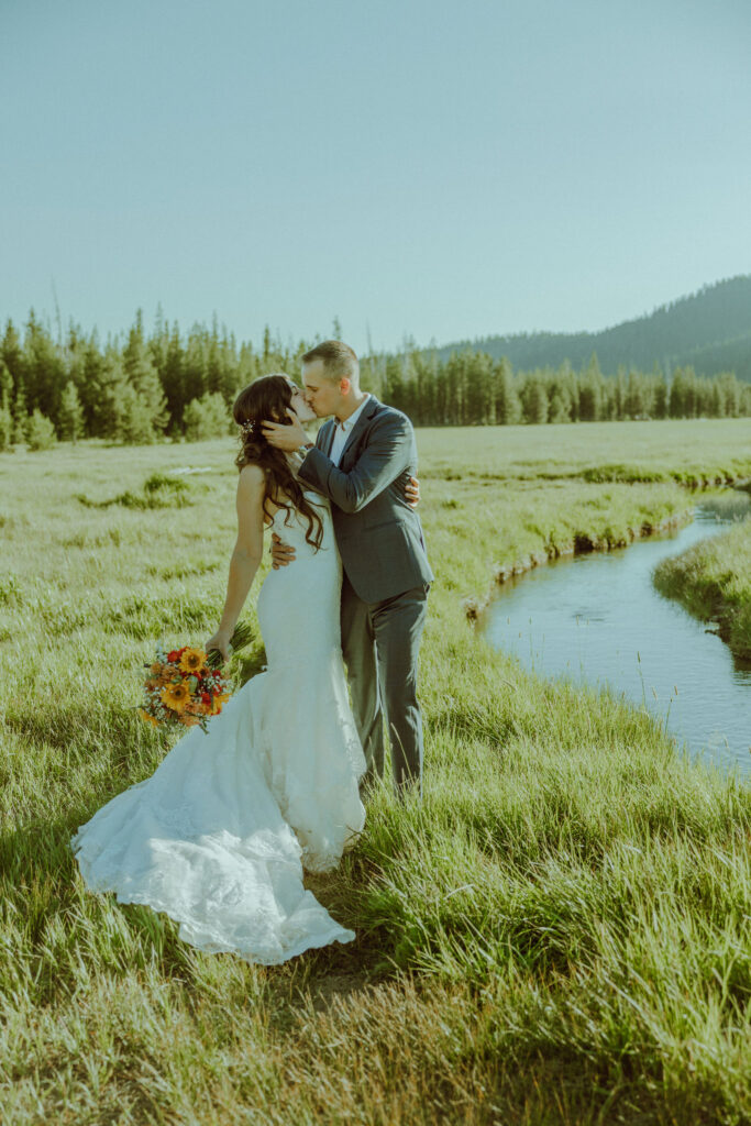 bride and groom kissing for photo at sparks lake oregon elopement location in bend 