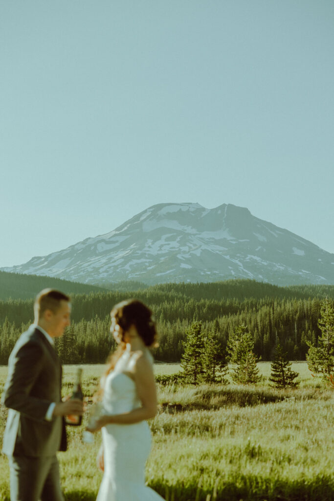 south sister in the background of bride and groom oregon elopement