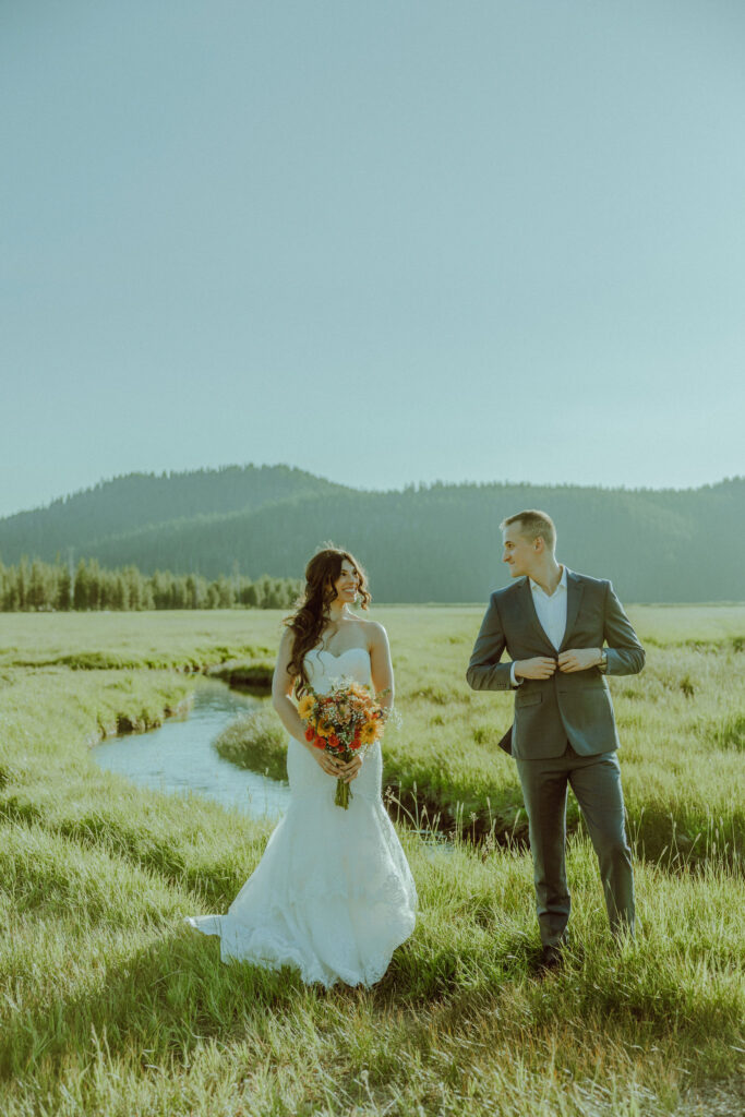 bride and groom pose for photo at sparks lake oregon elopement location in bend 