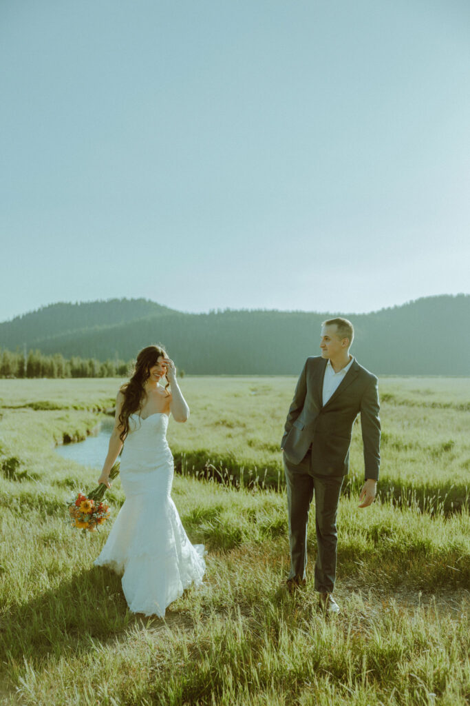 bride and groom walking at sparks lake oregon elopement location in bend 