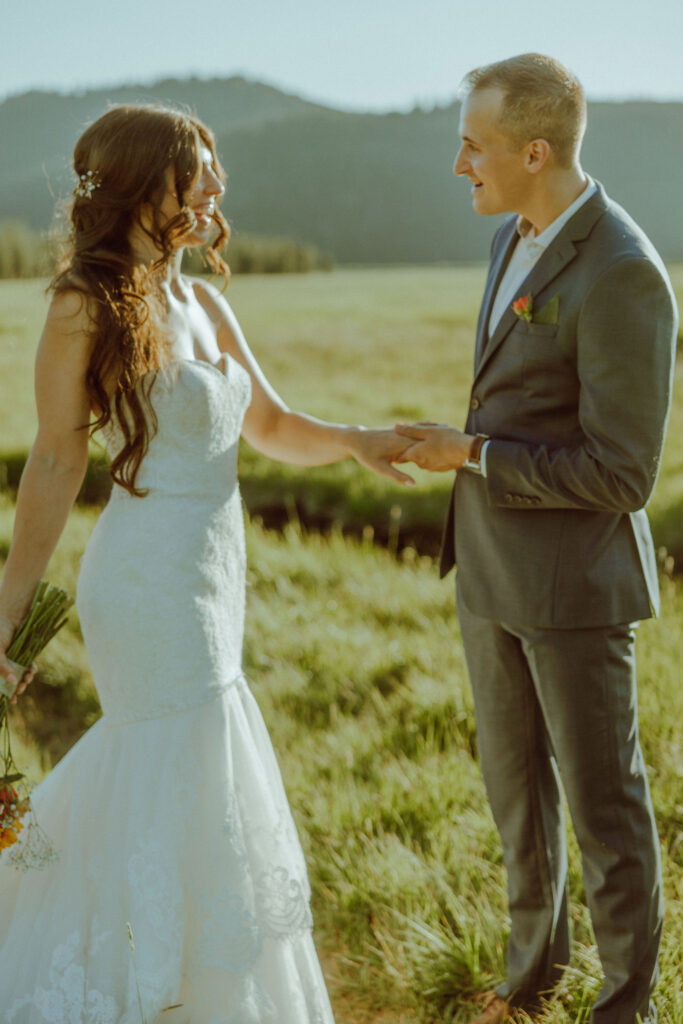 bride and groom pose for photo at sparks lake oregon elopement location in bend 