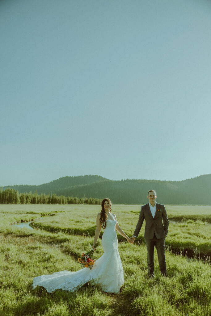 bride and groom pose for photo at sparks lake oregon elopement location in bend 