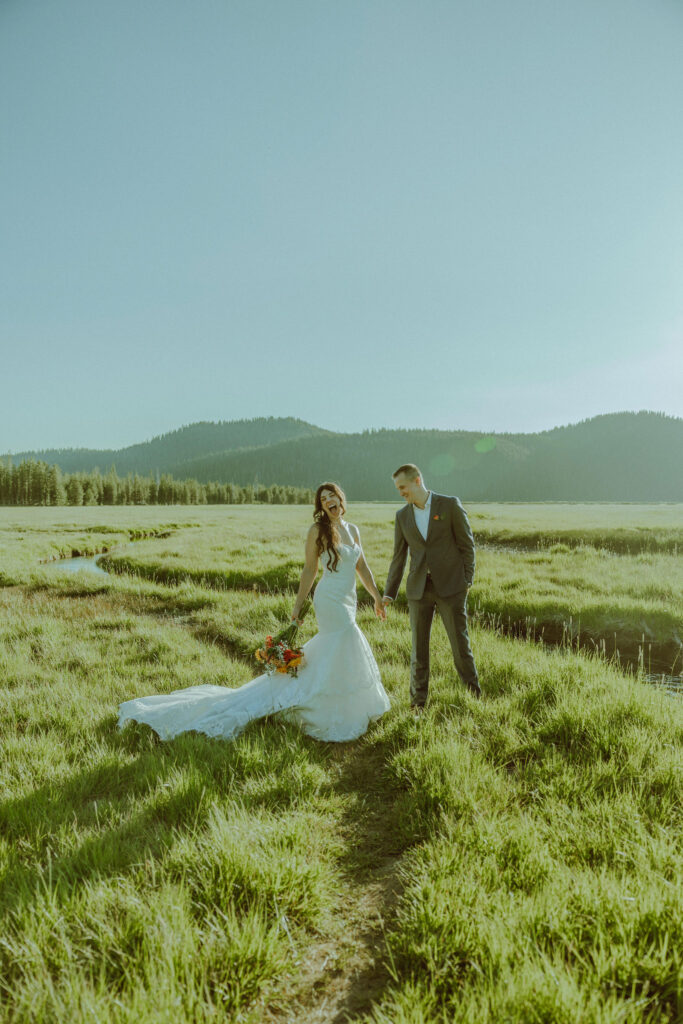 bride and groom pose for photo at sparks lake oregon elopement location in bend 