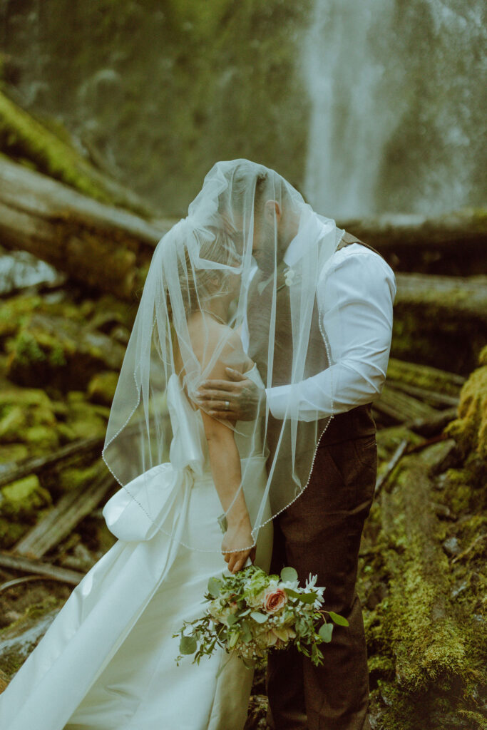 bend bride and groom at their proxy falls elopement in oregon 