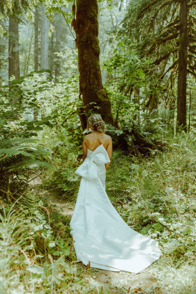 oregon bride posing in oregon forest 