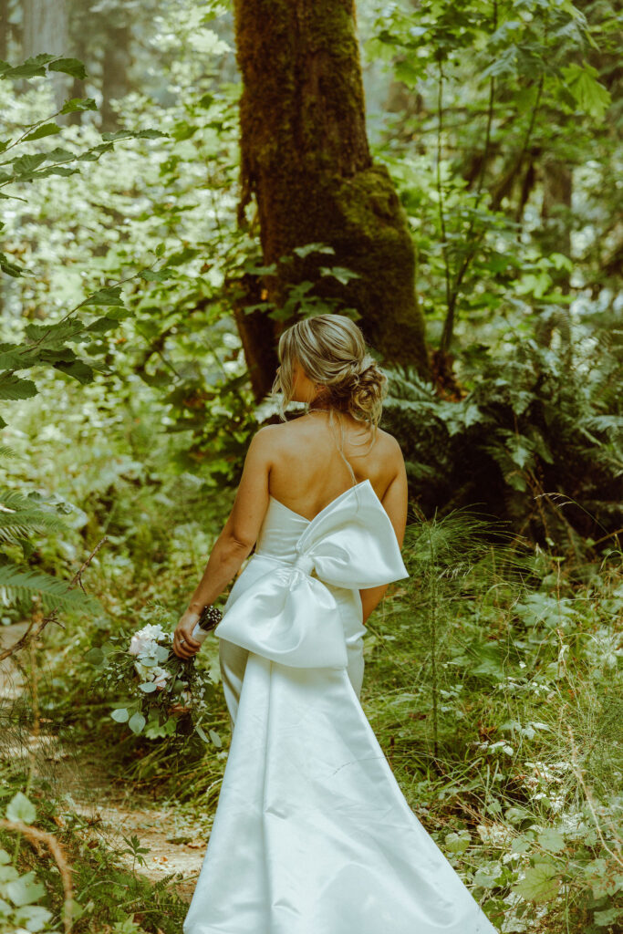 oregon bride posing in oregon forest 