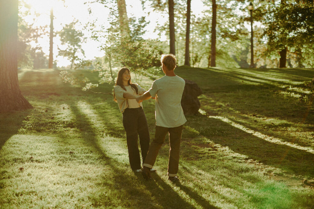 engaged couple poses playfully for cinematic photoshoot
