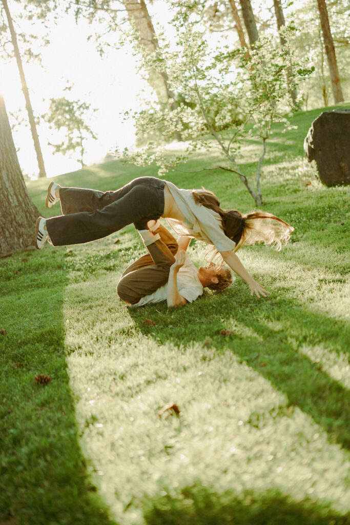 engaged couple poses playfully for cinematic photoshoot