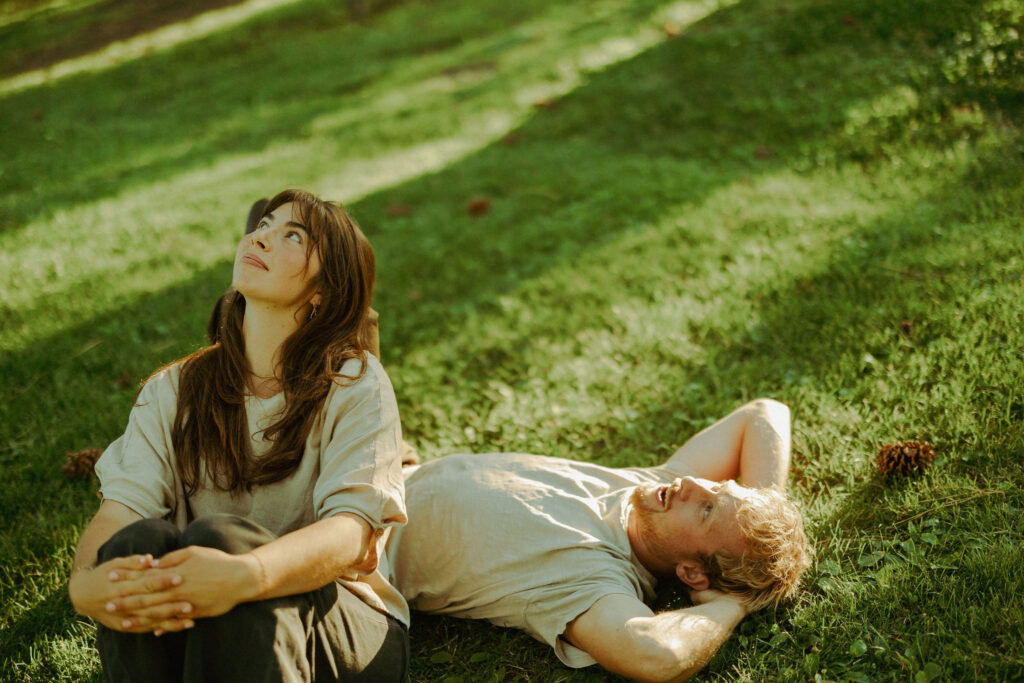 engaged couple poses softly for camera